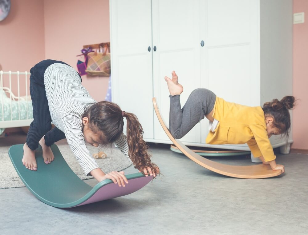 Young Girls exercising on Wobbel Balance Boards from Oskar's Wooden Ark in Australia