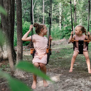 Active play outdoors - 2 children playing on Solvej Scandi wooden swings from Oskar's Wooden Ark in Australia