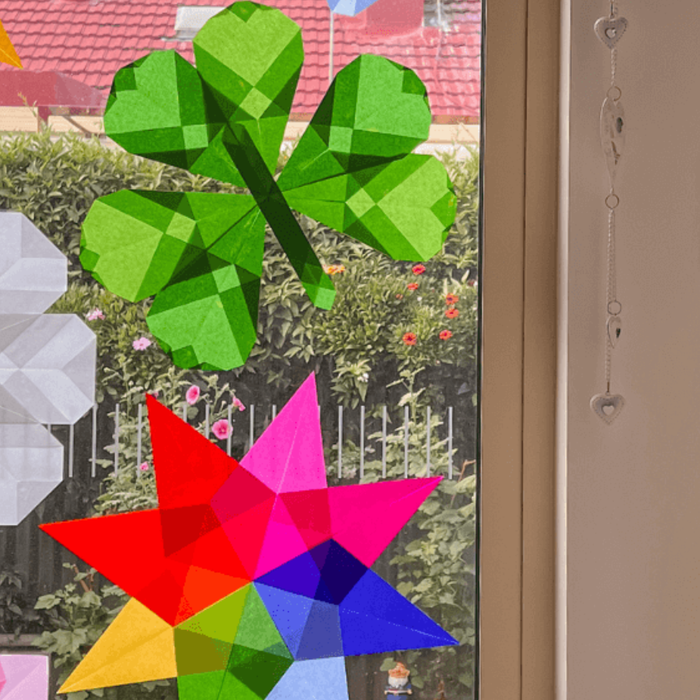 Simple kite paper window art display on the window, beautifully catching the light. 