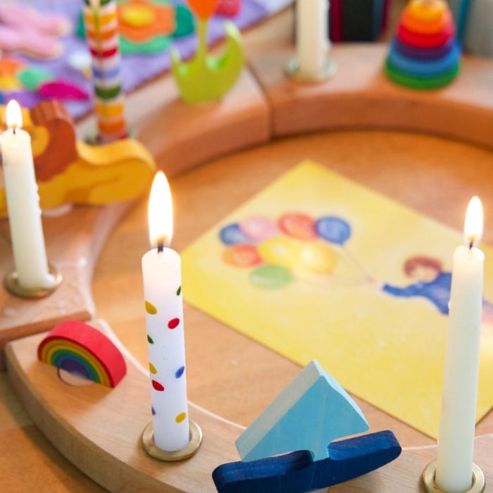 Grimm's Celebration Ring styled for a Birthday celebration with decorations, candles, toys and artwork