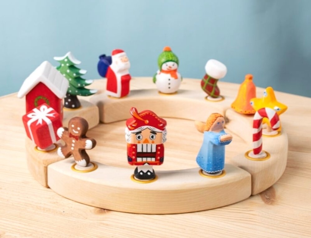 Christmas figurines in natural wooden celebration ring at Oskar's Wooden Ark