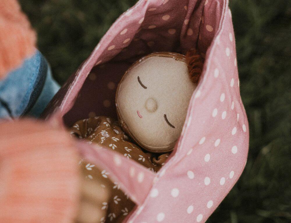 Imaginative play with Olli Ella Doll in carrier