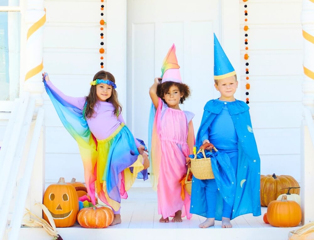 Children dressed up for Halloween Trick or Treating in Sarah's Silks Dressing Up Costumes from Oskar's Wooden Ark in Australia