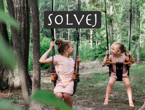 Two smiling young girls in the woods swinging on SOLVEJ Swings from Australia