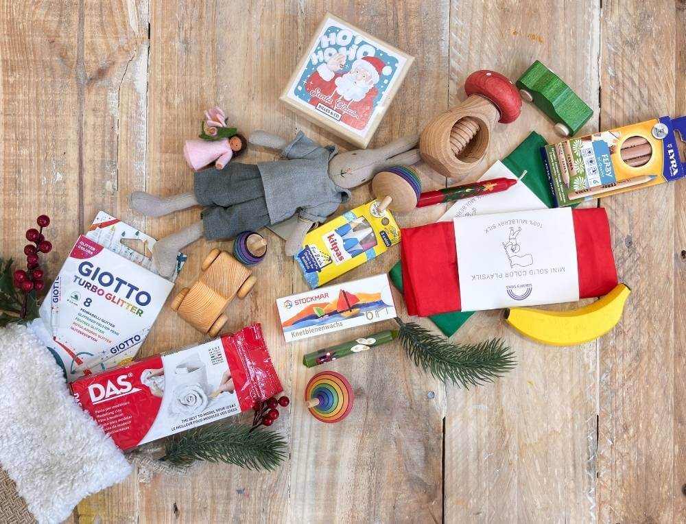 Christmas stocking with assorted children's eco toys and craft supplies from Oskar's Wooden Ark