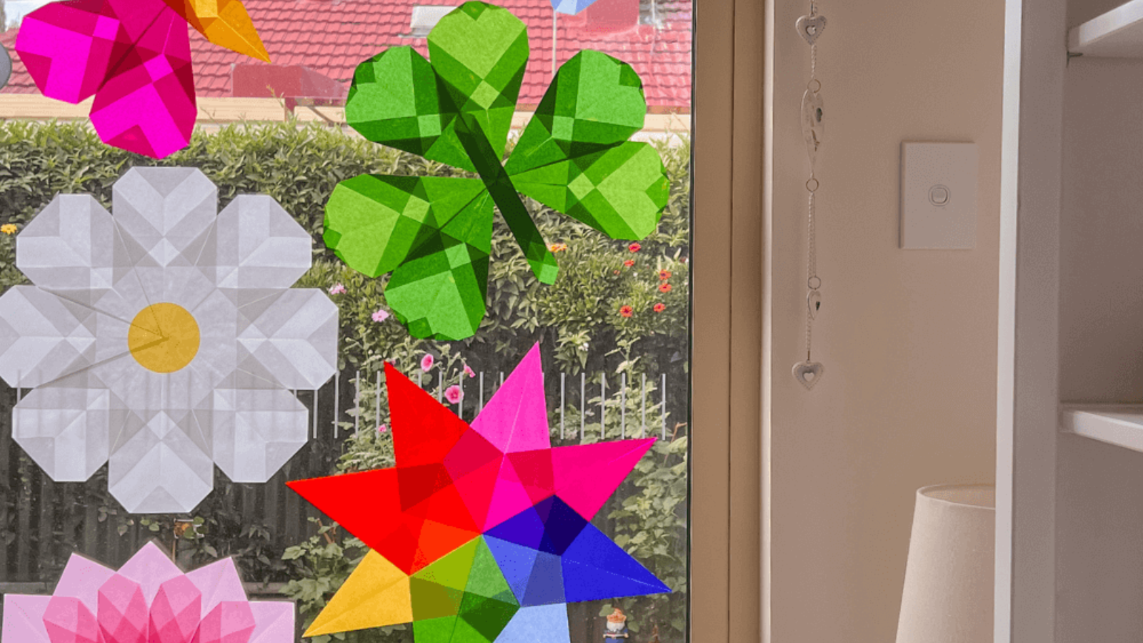 Simple kite paper window art display on the window, beautifully catching the light. 