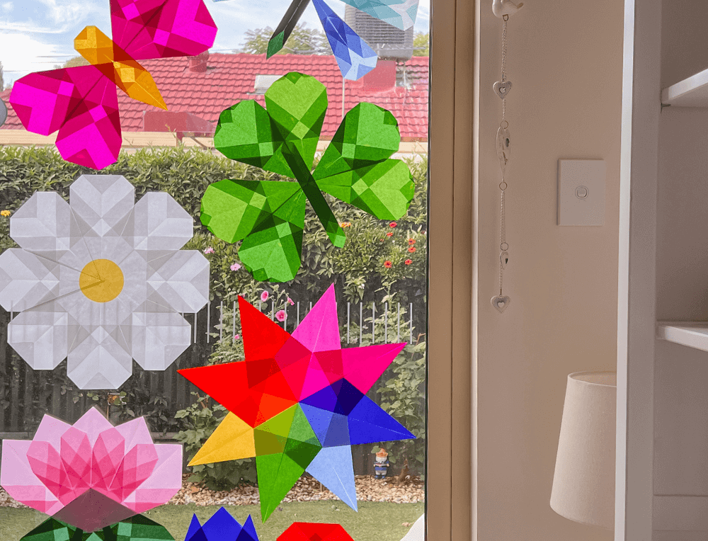 Simple kite paper window art display on the window, beautifully catching the light.