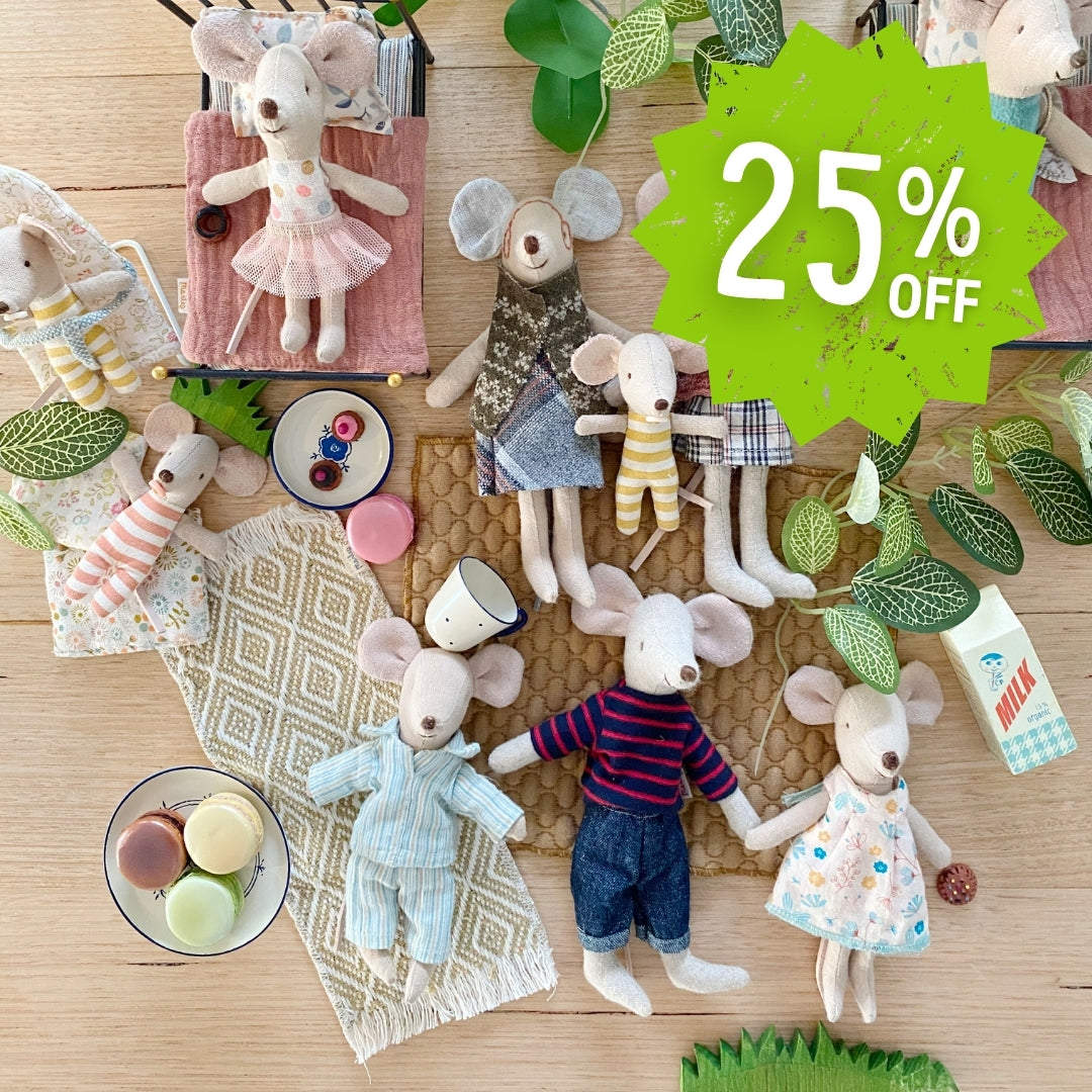Collection of Maileg mouse dolls with clothing and accessories on a wooden surface, with a 25% off label.
