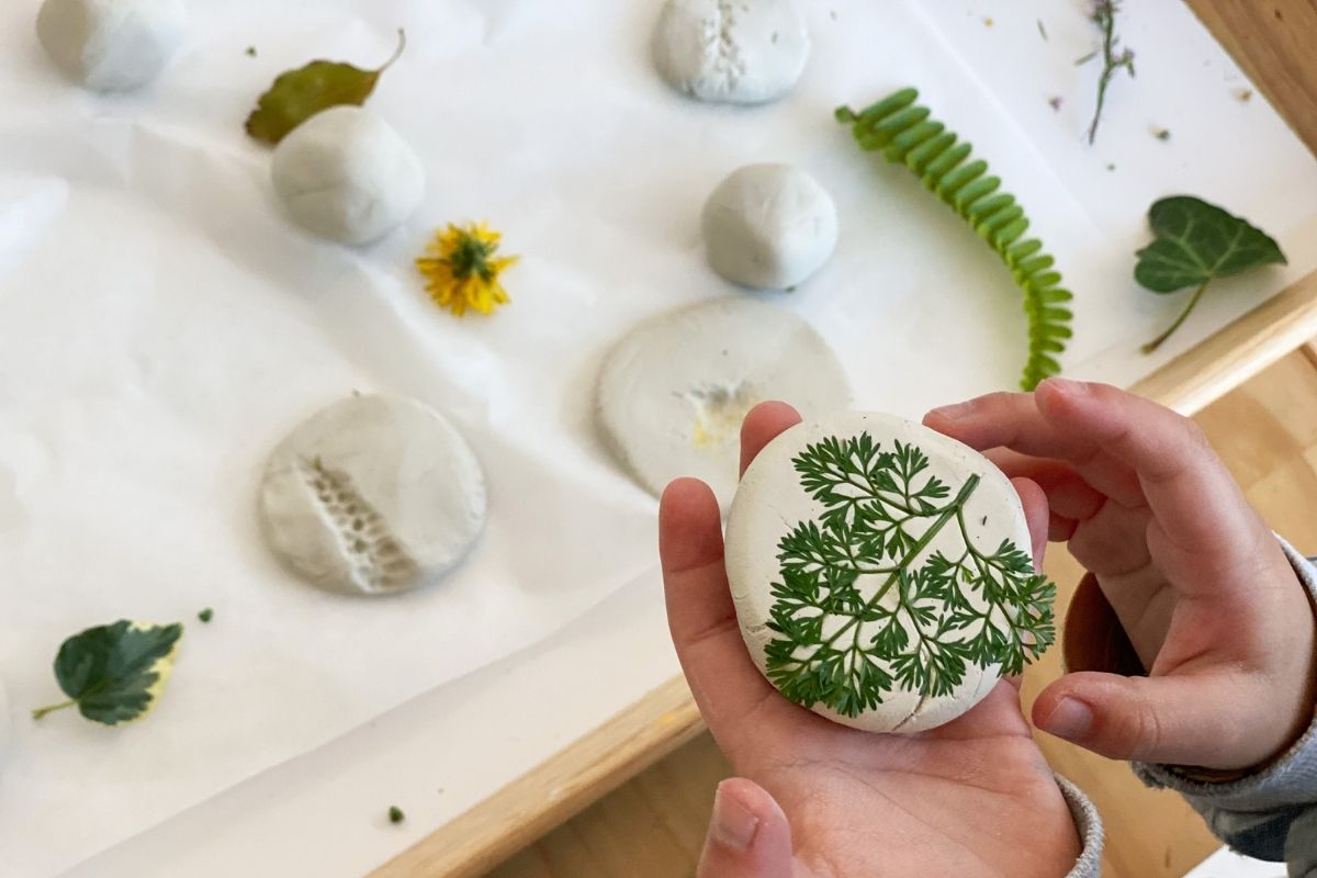 Hand holding a DAS clay creation - craft materials on sale at Oskar's Wooden Ark