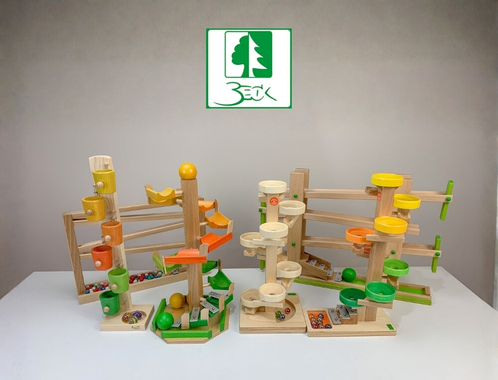 Beck Wooden Toys lifestyle image with logo, featuring three wooden toy marble run structures with colourful cups, balls, and platforms – Oskar's Wooden Ark