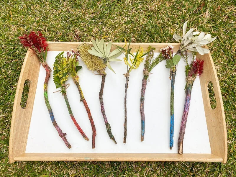 Handmade nature wands decorated with flowers, leaves and Kitpas Crayons