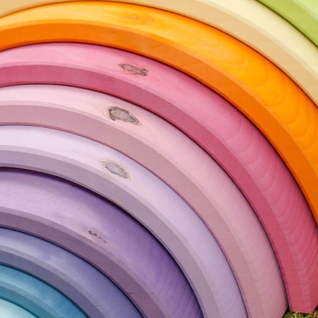 Grimm's Wooden Rainbow - Demonstrating the unique markings and wood grain of natural wooden toys