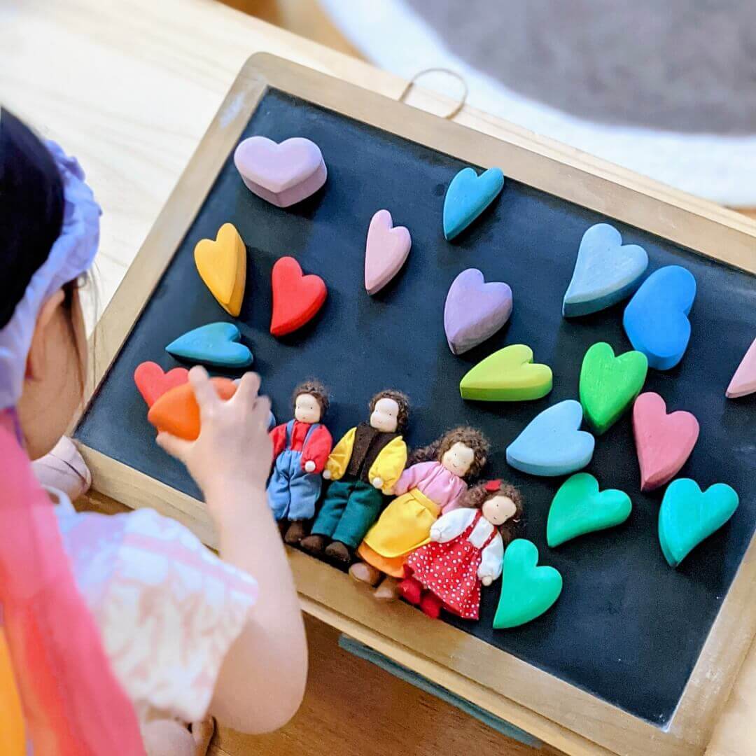 Imaginative play with Grimm's Wooden Toys Family Dolls and Wooden Hearts from Oskar's Wooden Ark in Australia