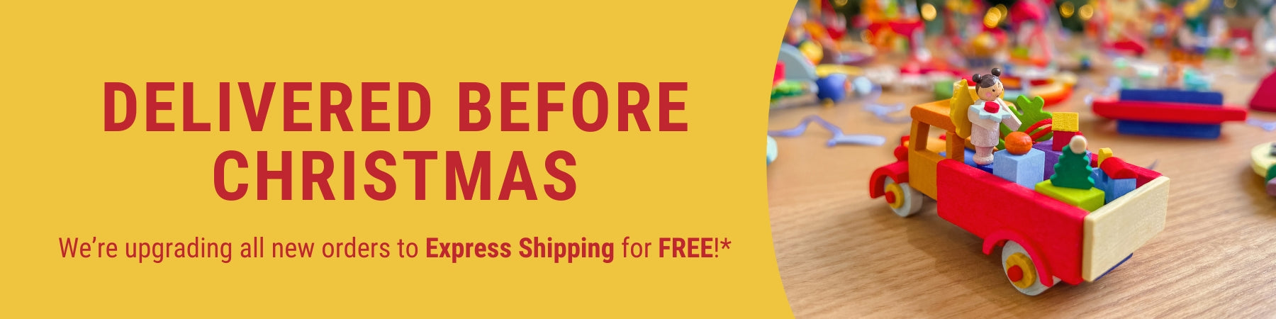 Graupner truck with Christmas decorations on a table, yellow banner with text about free express shipping.