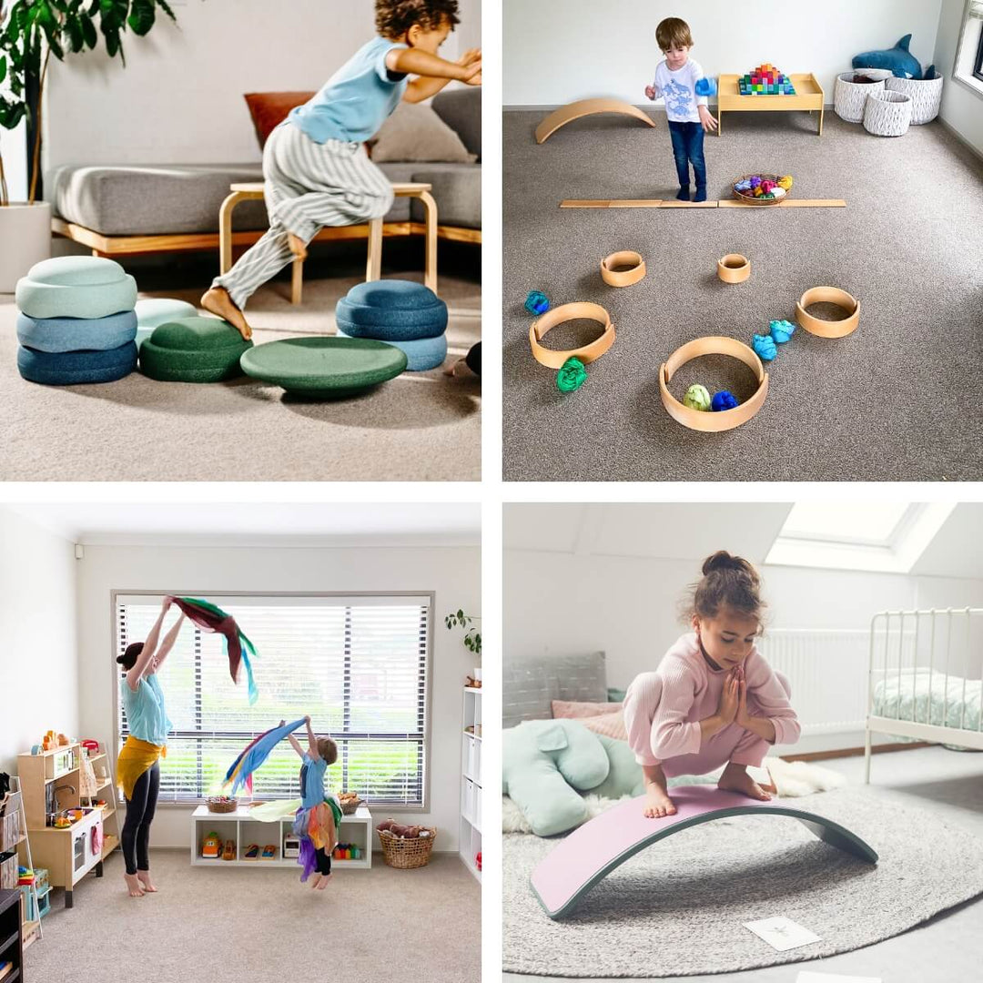Active indoor play: a boy jumping across Stapelstein stepping stones, a toddler on a ring and plank obstacle course, a mother and child dancing with playsilks, and a girl in a yoga pose on a Wobbel Board.
