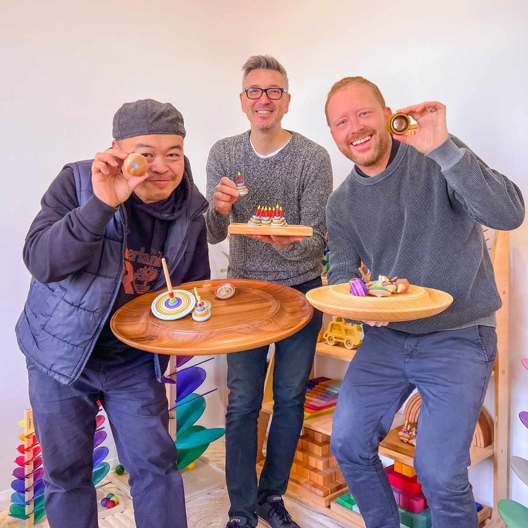 Oskar's Wooden Ark team holding Mader spinning tops and wooden spinning plates at a Mader Live event