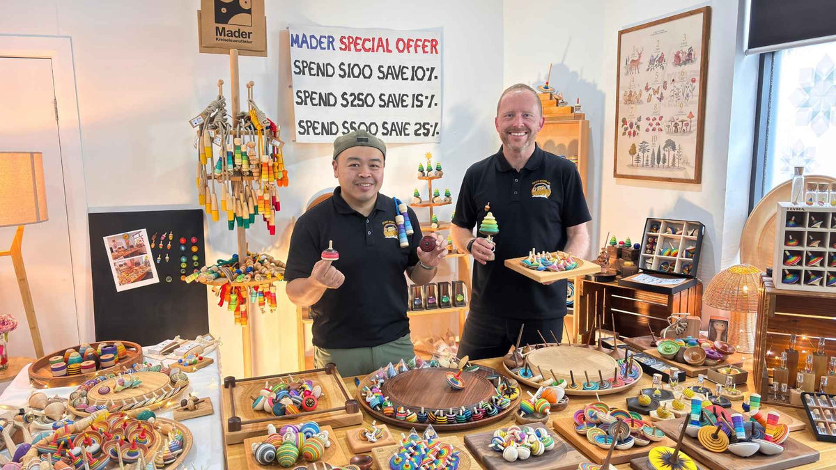 Oskar's Wooden Ark team holding Mader spinning tops and wooden spinning plates at a Mader Live event