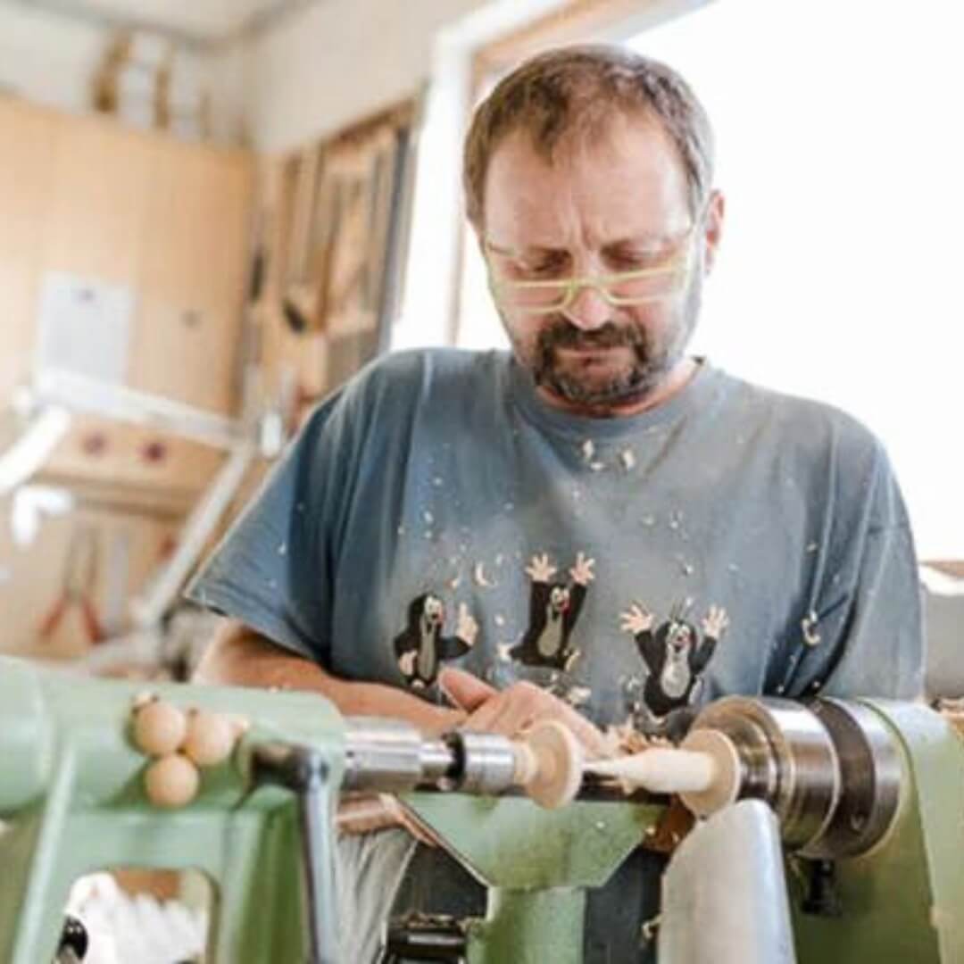 Klaus Mader creating his unique wooden Mader spinning tops, available in Australia from Oskar's Wooden Ark