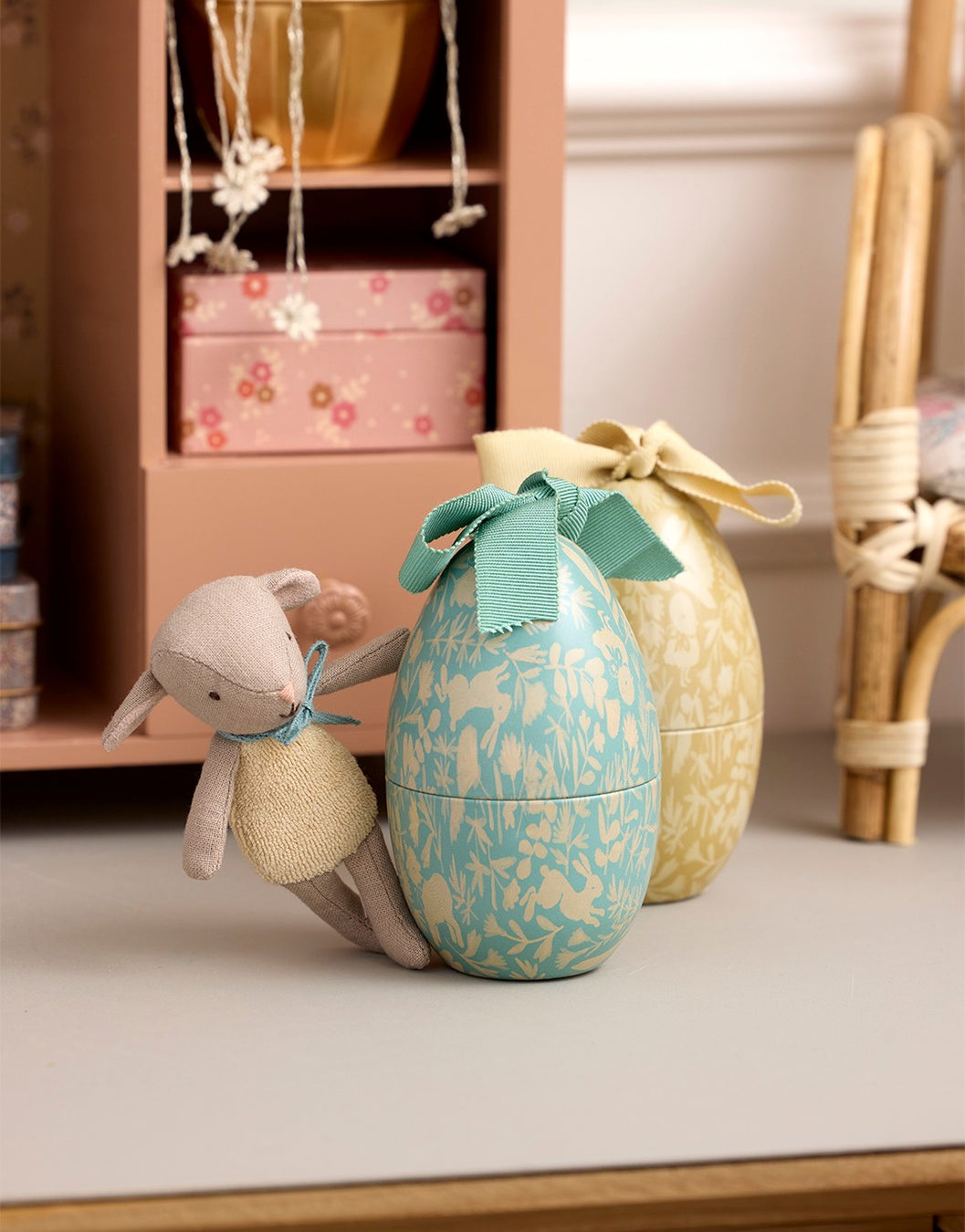 Maileg Decorative Easter eggs with a plush toy rabbit on a table