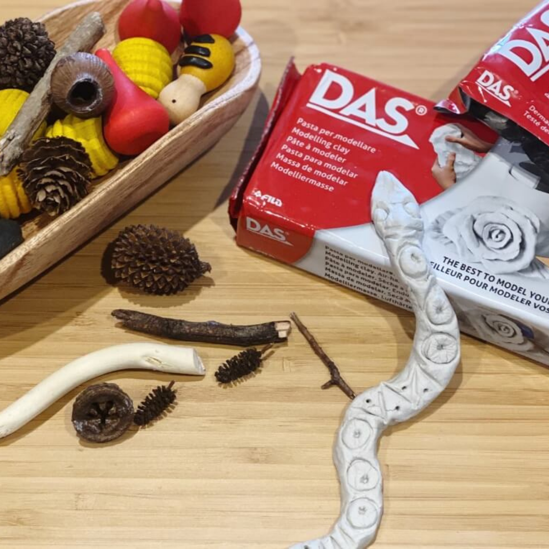 Handmade Rainbow Serpent moulded from DAS air-dry modelling clay, decorated with natural twig and gumnut patterns
