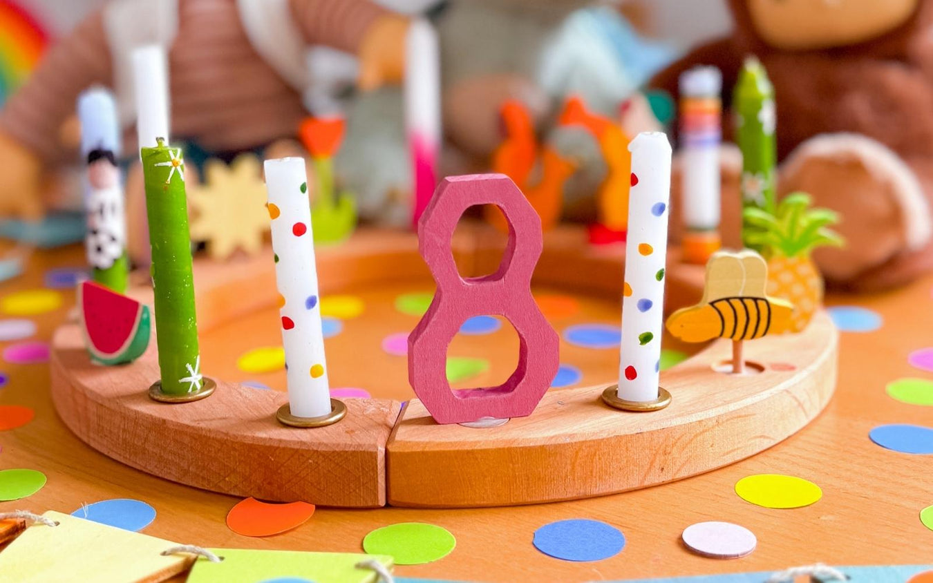 Birthday celebration ring with number 8 and candles with colourful wooden decorations