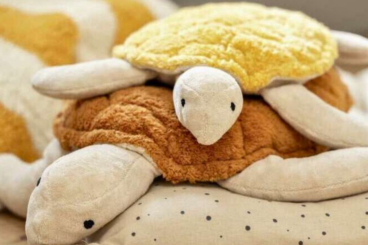 SENGER plush turtle toys on a soft surface with a neutral background