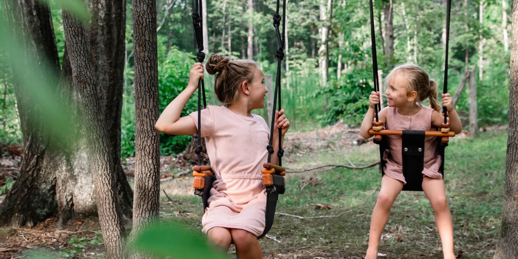 Children swinging on SOLVEJ swings from Oskar's Wooden Ark in Australia