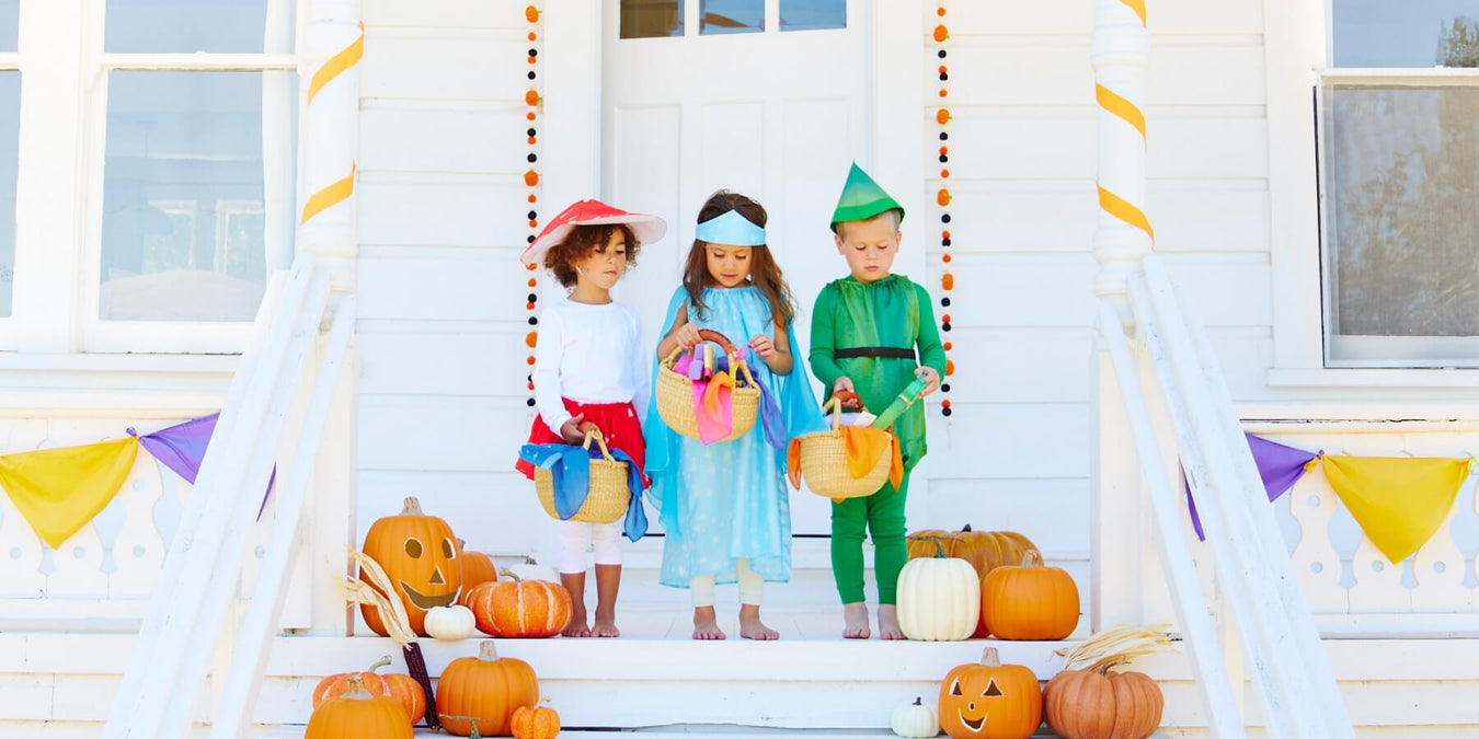 Children dressed up for Halloween Trick or Treating in Sarah's Silks Dressing Up Costumes from Oskar's Wooden Ark in Australia