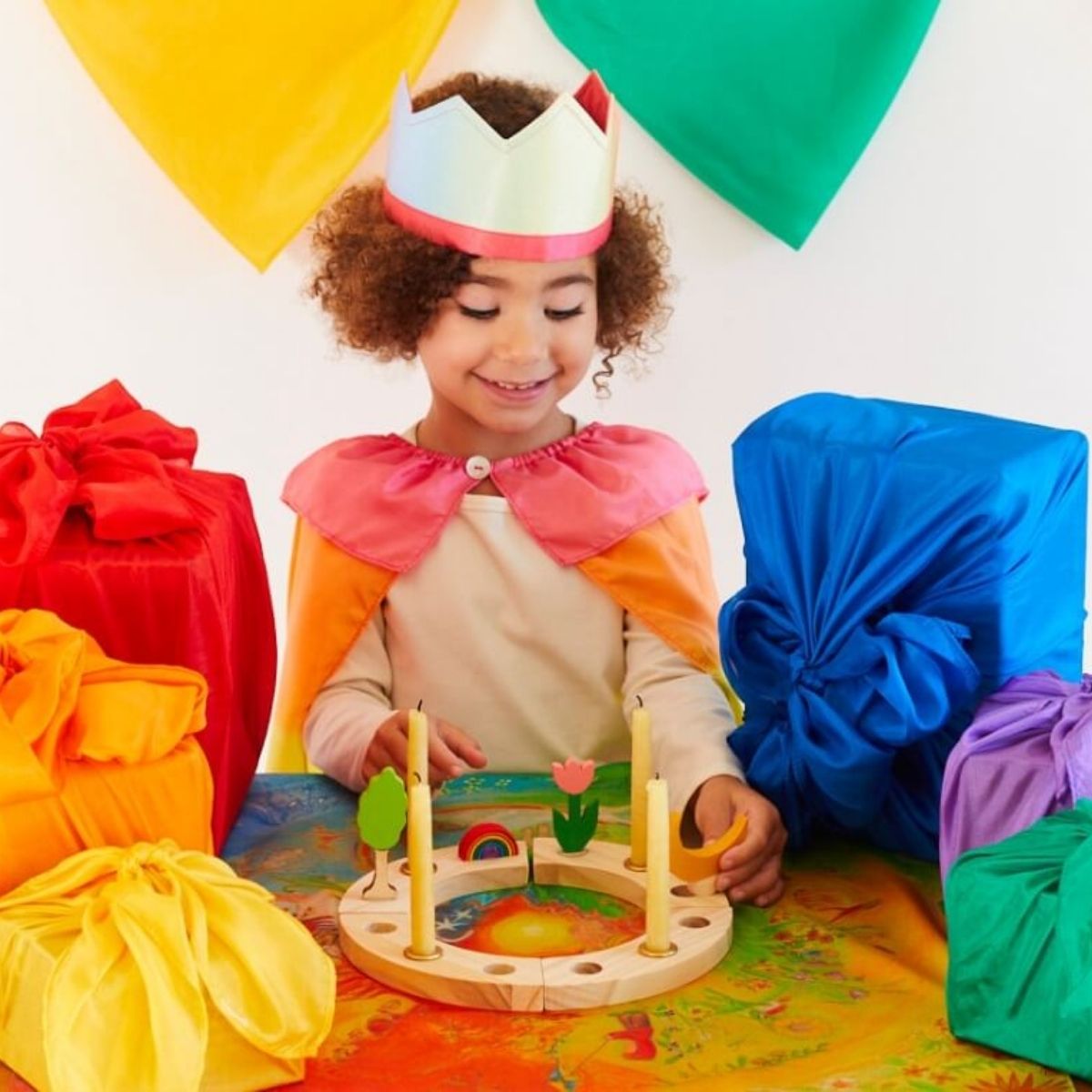 Sarah's Silks Playsilks used as gift wrapping, bunting and dressing up accessories for a birthday party