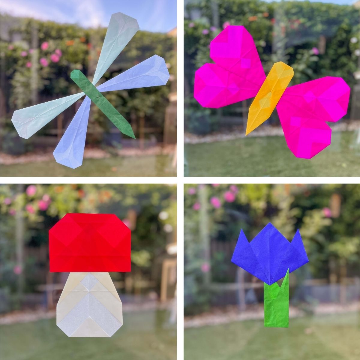 Four simple paper window crafts arranged on a window pane.