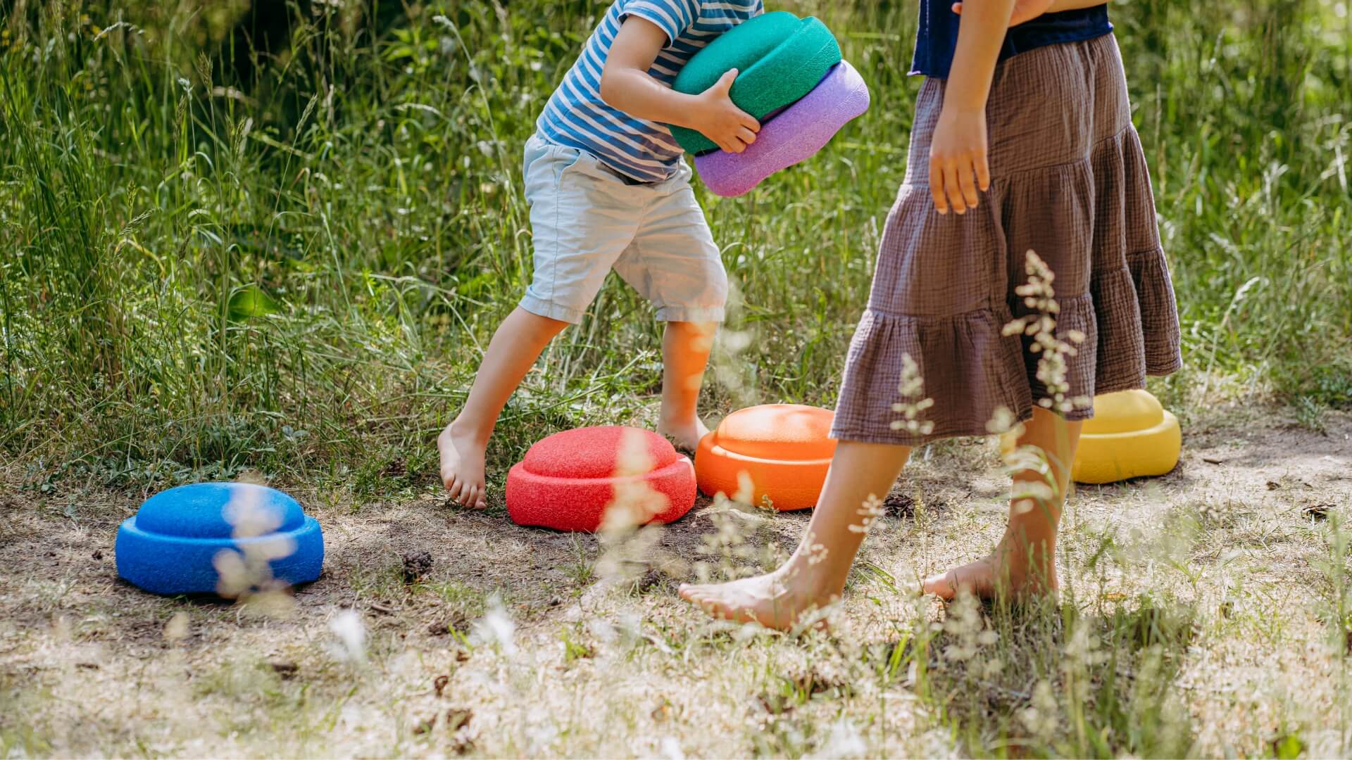 Child and parent playing with cStapelstein in a natural setting