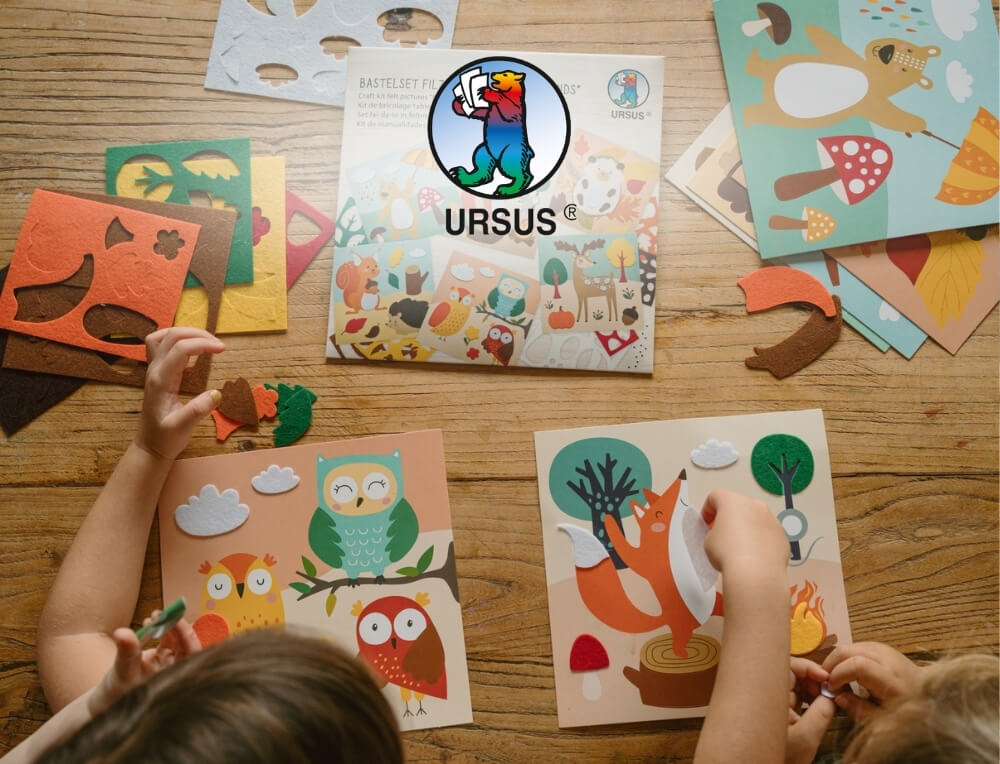 URSUS Paper Craft lifestyle image with logo, featuring a children's craft activity kit with forest-themed felt pieces – Oskar's Wooden Ark