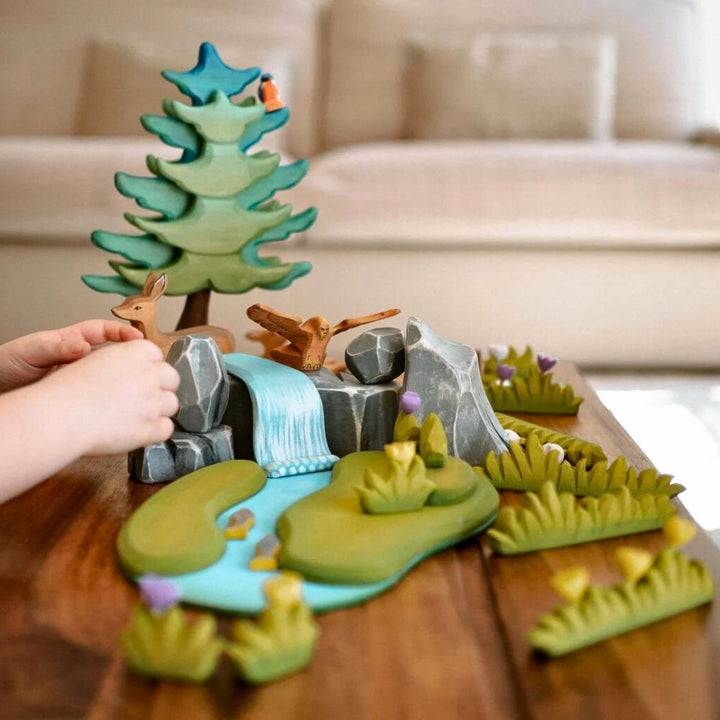 BumbuToys Handcrafted Waterscape Wooden Figures River Plate, Waterfall & River Rocks Set of 7 from Australia set up in a small world play scape
