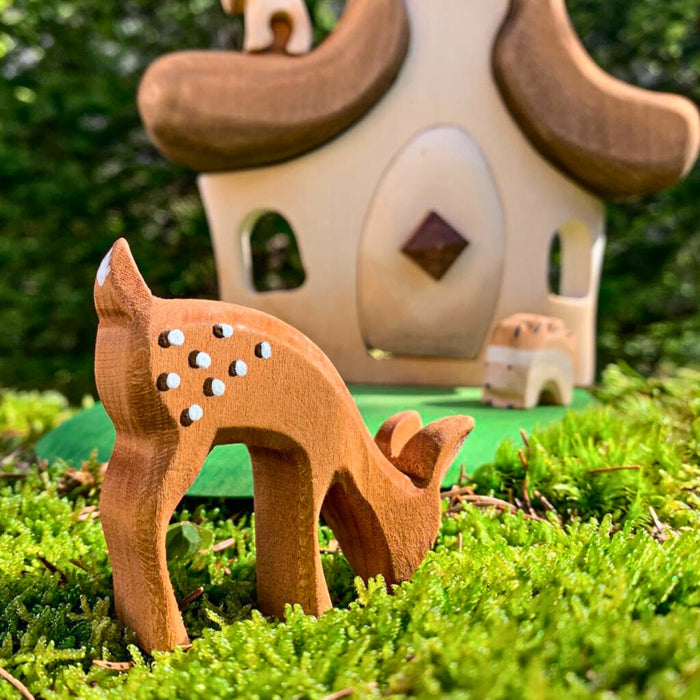 BumbuToys Handcrafted Wooden Animal Grazing Deer Fawn from Australia in a small-world play setting