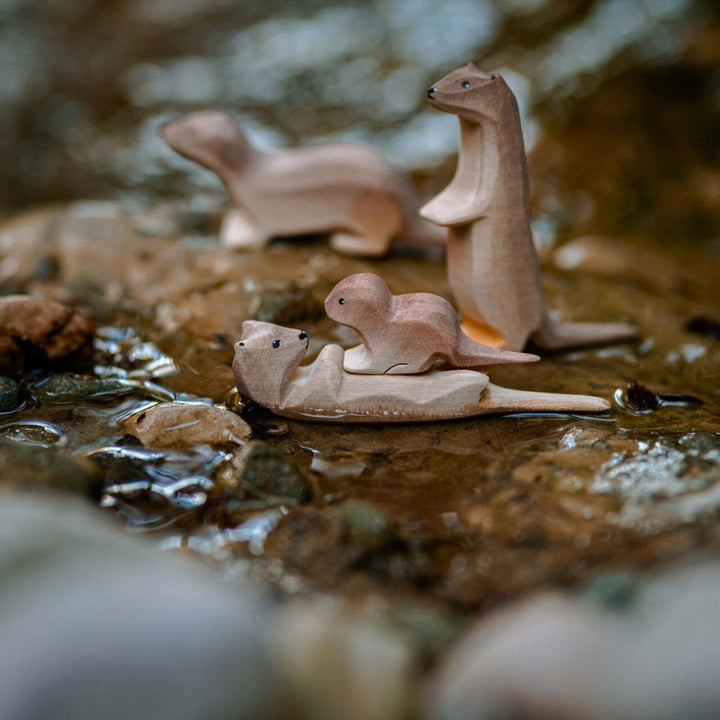 BumbuToys Handcrafted Wooden Animal Otter Standing from Australia in a small-world play setting