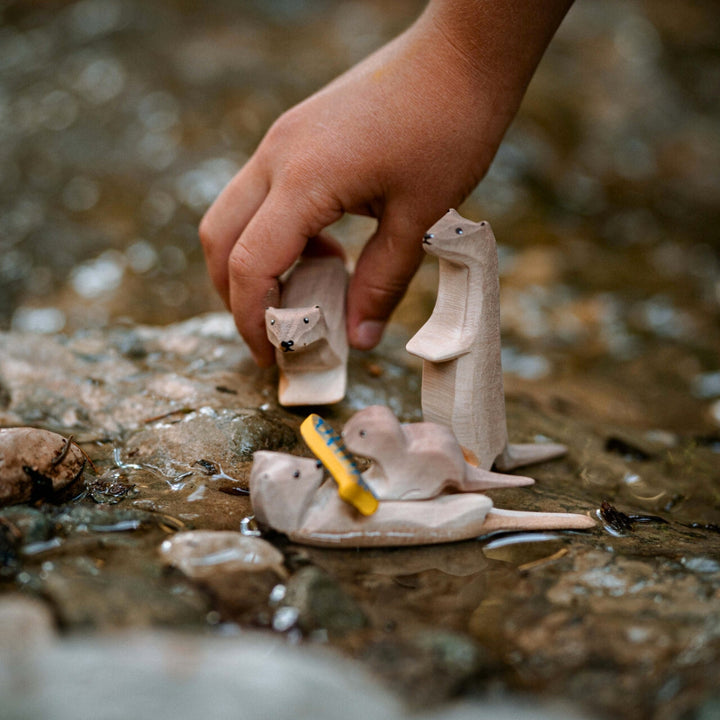 BumbuToys Handcrafted Wooden Animal Otter from Australia in a small-world play setting