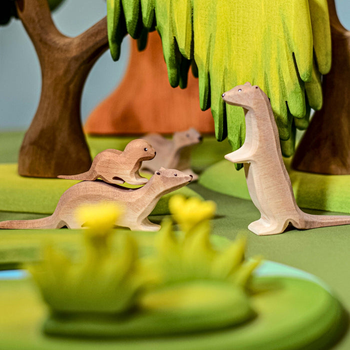 BumbuToys Handcrafted Wooden Animal Otter Standing from Australia in a small-world play setting