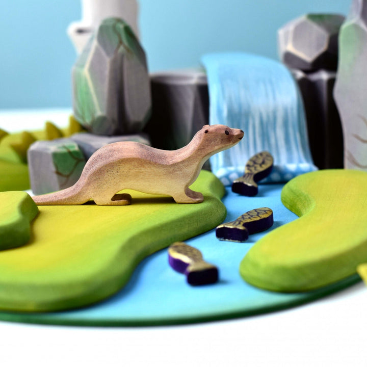 BumbuToys Handcrafted Wooden Animal Otter from Australia in a small-world play setting