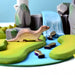 BumbuToys Handcrafted Wooden Animal Otter from Australia in a small-world play setting
