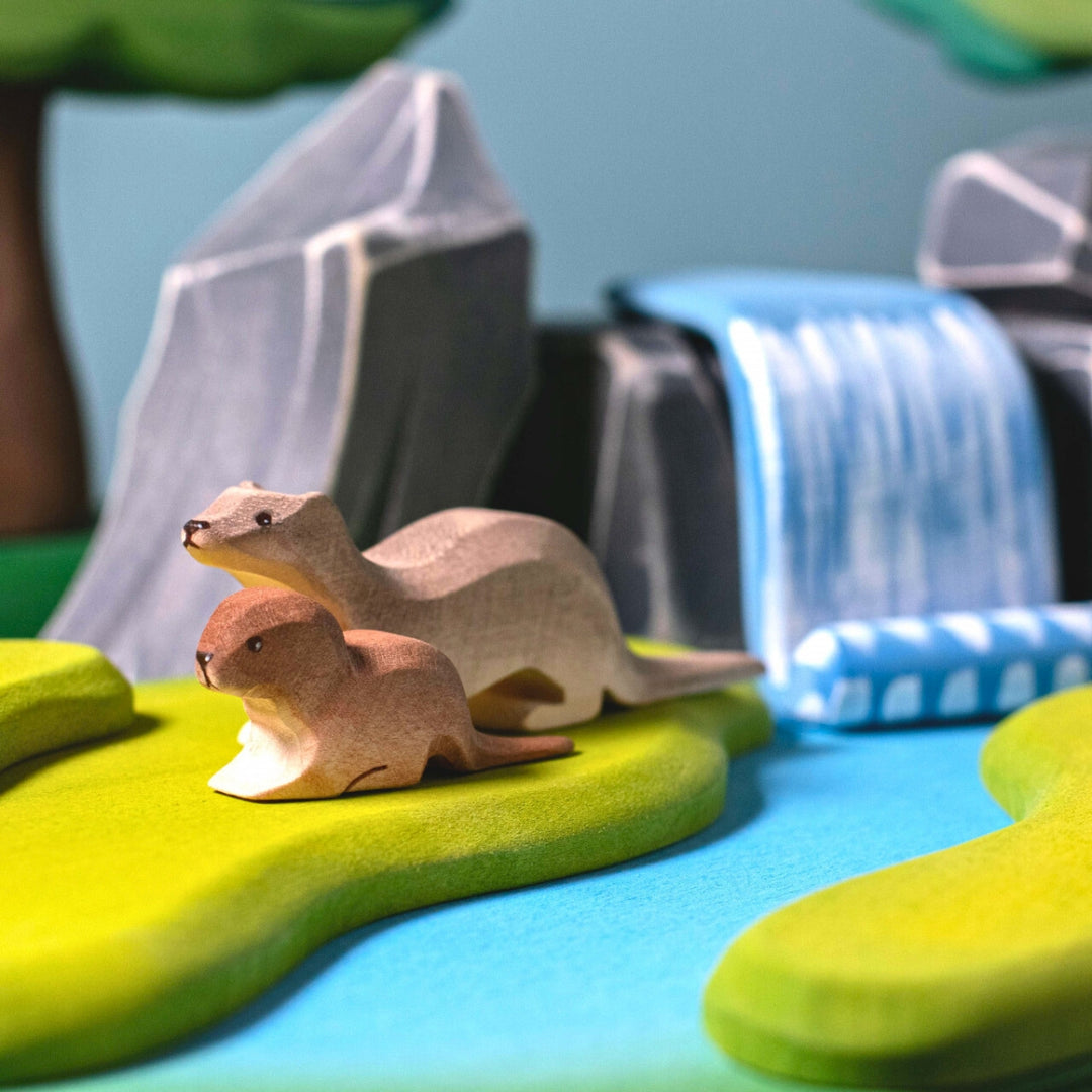 BumbuToys Handcrafted Wooden Animal Baby Otter from Australia in a small-world play setting