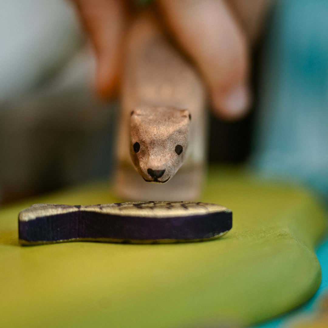 BumbuToys Handcrafted Wooden Animal Otter from Australia in a small-world play setting