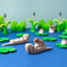 BumbuToys Handcrafted Wooden Animal Sleeping Otter from Australia in a small-world play setting