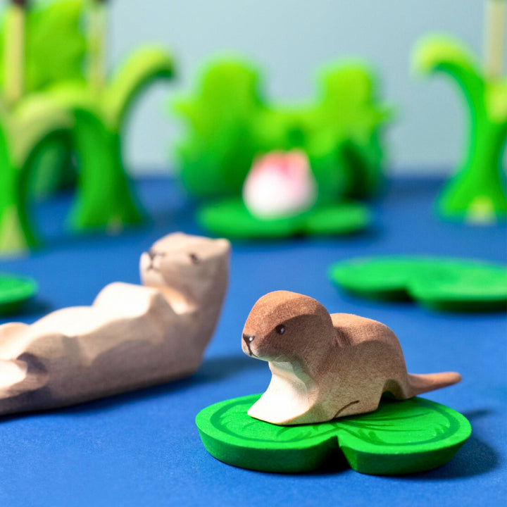 BumbuToys Handcrafted Wooden Animal Baby Otter from Australia in a small-world play setting