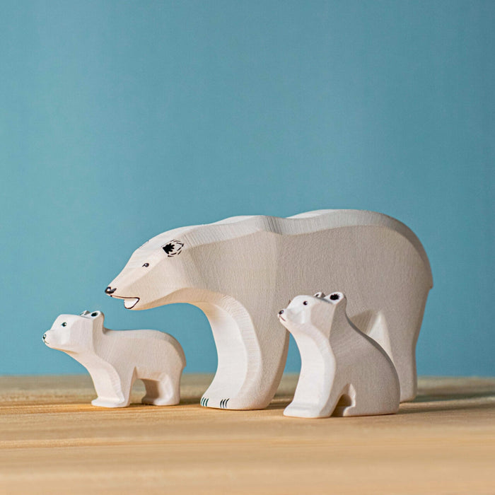 BumbuToys Handcrafted Wooden Animal Polar Bear Baby Sitting from Australia in a small-world play setting