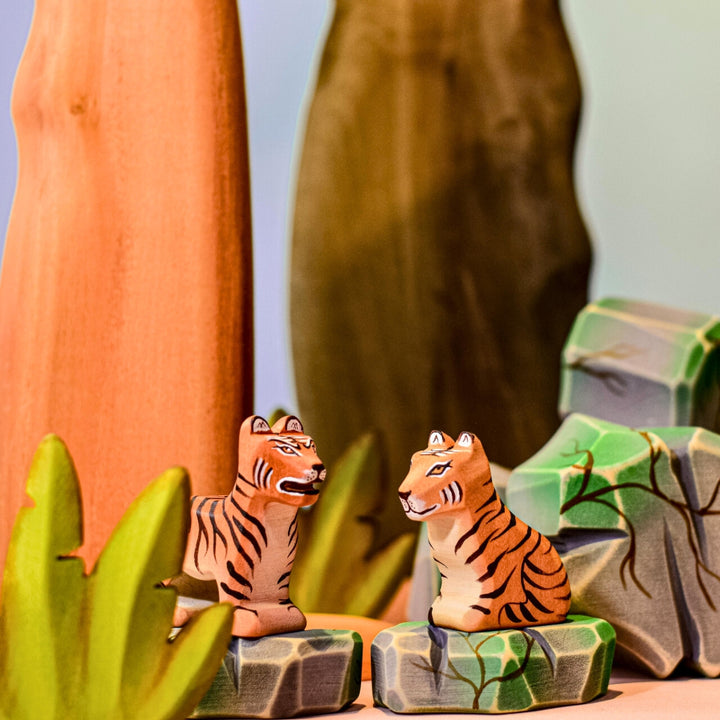BumbuToys Handcrafted Wooden Animal Tiger Cub Sitting in a small-world play setting