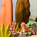 BumbuToys Handcrafted Wooden Animal Tiger Cub Sitting in a small-world play setting