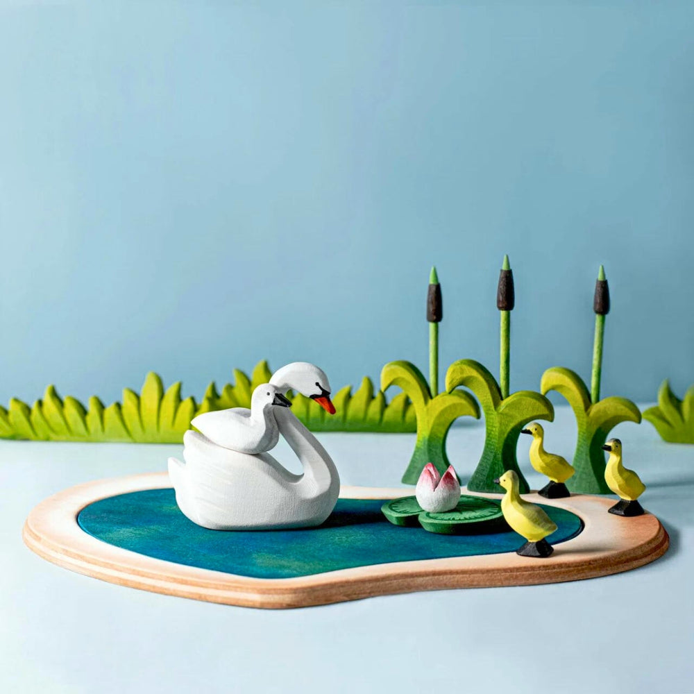 BumbuToys Handcrafted Wooden Birds from Australia in a small-world farm play setting
