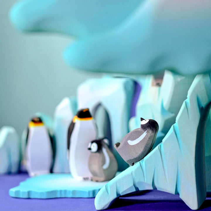 BumbuToys Handcrafted Wooden Bird Emperor Penguins from Australia in a small-world play setting
