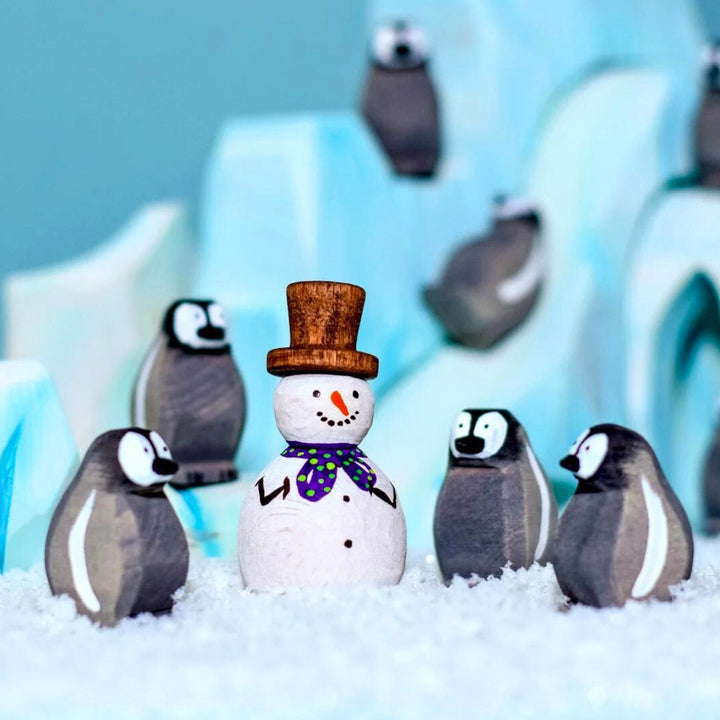 BumbuToys Handcrafted Wooden Bird Emperor Penguins from Australia in a small-world play setting