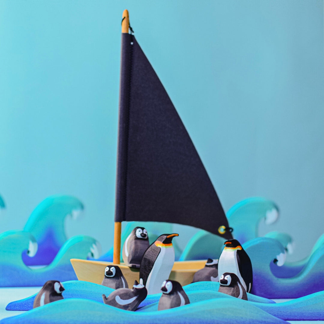 BumbuToys Handcrafted Wooden Bird Emperor Penguin Family Set from Australia in a small-world play setting